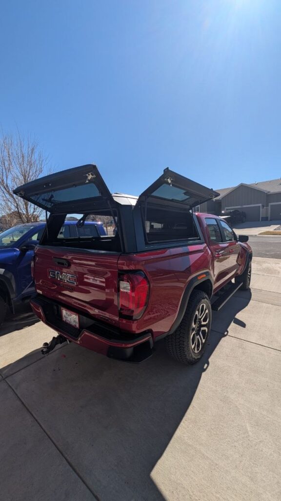 Pickup with an Overlandico aluminum truck topper, Miami service area